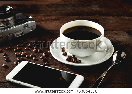 coffee camera and smartphone on wooden table. travel   concept