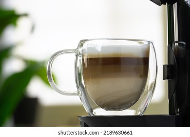 Coffee Capsule Machine Pouring Cappuccino Into Glass Cup