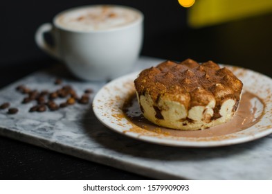 Coffee Capuchino With Tiramisu Dessert And Coffee Beans