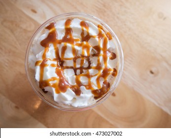 Coffee Caramel Frappe With Whipped Cream In A Coffee Shop.Top View