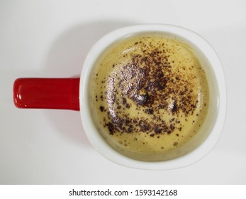 Coffee With Coca Powder On A White Surface (top View)