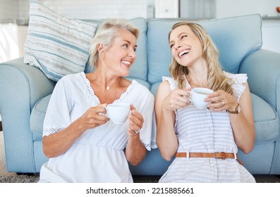 Coffee, comic communication and mother with daughter on the living room floor of their house. Elderly woman speaking, giving advice and in conversation with her adult child with tea in the lounge - Powered by Shutterstock