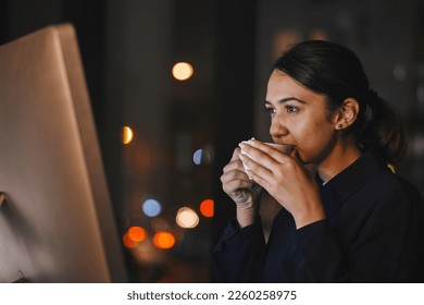 Coffee, computer and night with a business woman in the office, working overtime late for a deadline. Research, thinking and caffeine with a dedicated female employee at work on a global project - Shutterstock ID 2260258975