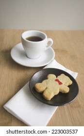Coffee and cookie on a table