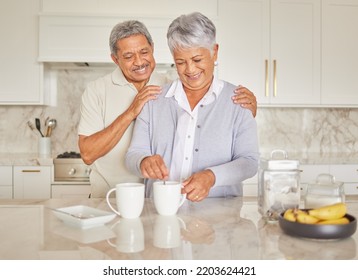 Coffee, Couple And Love With A Senior Woman And Man Enjoying Retirement While Together In The Kitchen Of Their Home. Happy, Smile And Romance With An Elderly Male And Female Pensioner Making Tea