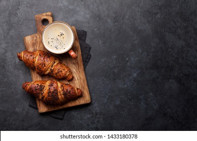 Coffee and croissant on stone table. French breakfast. Top view flat lay with copy space for your text - Powered by Shutterstock