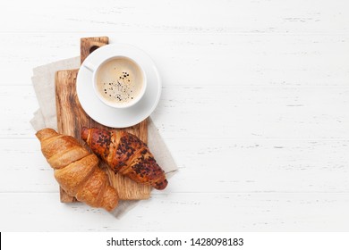 Coffee And Croissant On Wooden Table. French Breakfast. Top View Flat Lay With Copy Space For Your Text