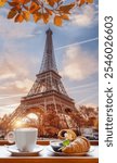 Coffee with croissants with symbol of Eiffel Tower in Paris, France