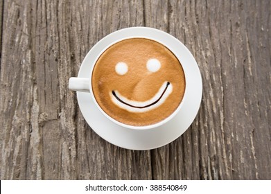 Coffee Cup With Artistic Cream Smile Face Decoration 