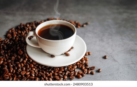 Coffee cup and coffee beans on  gray background, Black coffee cup aromatic