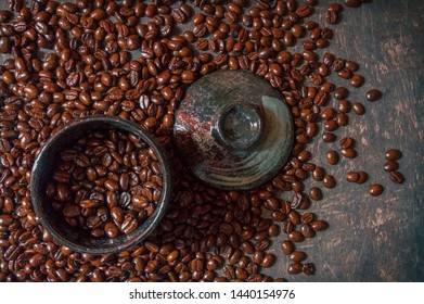 Coffee cup and coffee beans on the wooden floor. Top view with copy space for your text - Shutterstock ID 1440154976