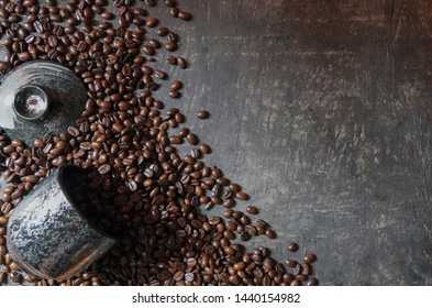 Coffee cup and coffee beans on the wooden floor. Top view with copy space for your text - Shutterstock ID 1440154982
