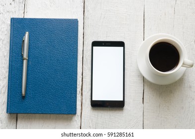 Coffee cup and book with wooden white background - Shutterstock ID 591285161