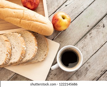 Coffee Cup And Breakfast Bread In On Wood Table