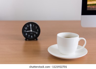 Coffee cup with clock on table, Coffee time concept.