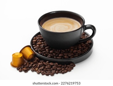 Coffee cup with fresh raw beans and coffee capsules on white. Creamy breakfast homemade drink