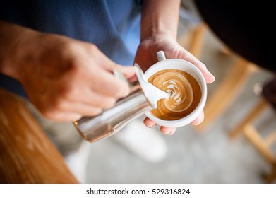 Coffee Cup Latte Art In Cafe