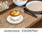 Coffee Cup, Latte art, caffeine and restaurant for cappuccino. Customer, hospitality and milk with foam for person, morning and barista for breakfast in Cafe or restaurant. Drink hot latte coffee