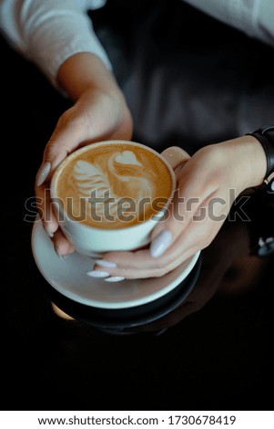 Similar – Hände halten eine Kaffeetasse mit Herzform.