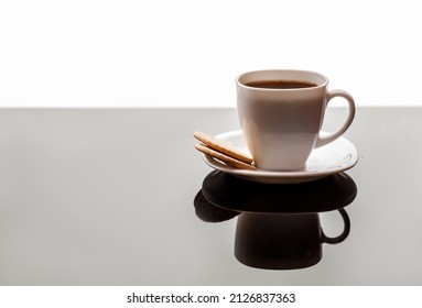 Coffee  Cup. Cup Of Coffee On  Glossy Black Surface. Black And White.