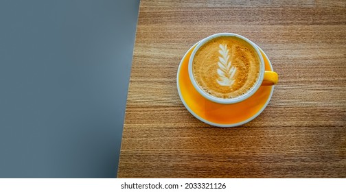 Coffee Cup On Light Wood Table As Banner Format With Copyspace.