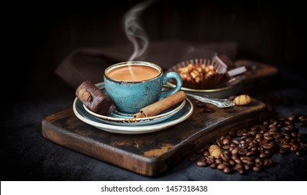 Coffee Cup On Rustic Background. Espresso With Cinnamon Sticks ,