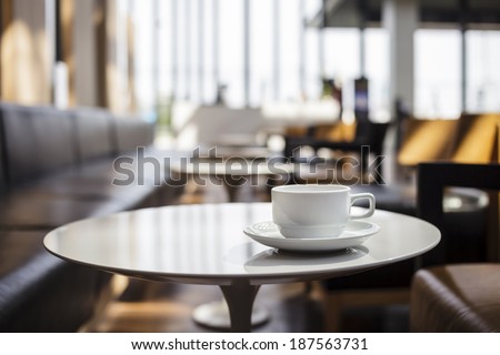 Coffee Cup on table Cafe shop Interior Blur people background