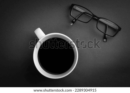 Coffee cup on the table with glasses