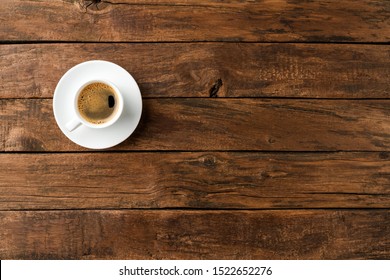 Coffee Cup On Vintage Wooden Table With Copyspace. Top View