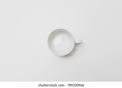 Coffee Cup On White Tabletop. Flat Lay, Top View