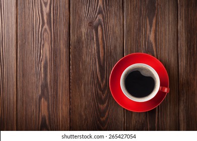 Coffee cup on wooden table background. Top view with copy space - Powered by Shutterstock