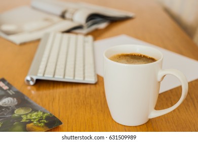 Coffee cup on the work table