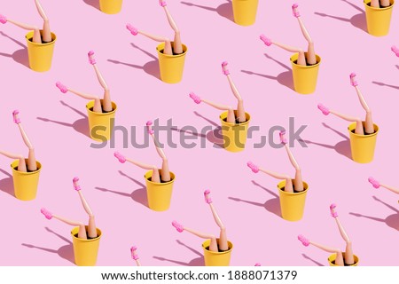 Coffee cup pattern with female doll legs and high heels on pink background. Minimal coffee shop concept with trend shadows. Caffeine lovers layout.