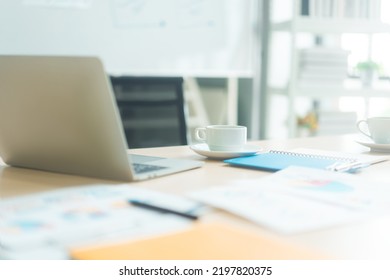 Coffee cup place on work table with laptop computer indoors office with morning sunlight. No people relax for break time. - Shutterstock ID 2197820375