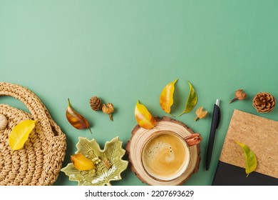 Coffee Cup, Planner, Bag And Autumn Leaves On Green Background. Stylish Boho Home Office Table. Top View, Flat Lay