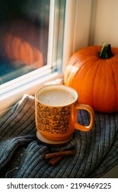 Coffee Cup With Pumpkins On Woolen Plaid On Window Sill. Hot Drink. Autumn, Fall Aesthetic Concept.