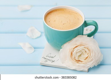 Coffee Cup With Spring Flower And Notes Good Morning On Blue Rustic Background, Breakfast On Mothers Day Or Womens Day.