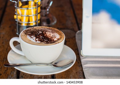 Coffee cup and tablet