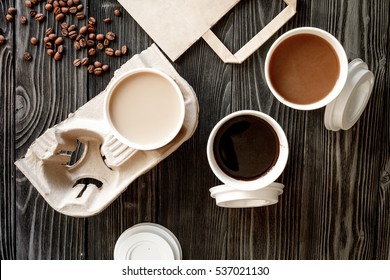 coffee cup take away at wooden background top view