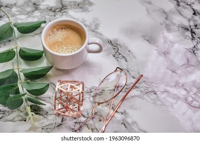 coffee cup, top view of coffee cup and eyeglasses on marble table background