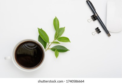 Coffee Cup Work Space With Computer Mouse,paperclip And Nice Pen On White Background,flat Lay