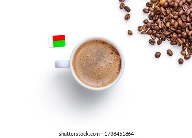 Coffee cups, coffee beans, and the flag of Madagascar on a white background.