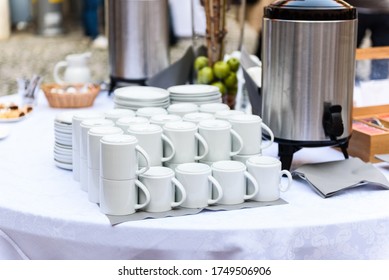 Coffee, Cups On Catering Table At Conference Or Wedding Banquet. Group Of Empty White Ceramic Cups For Coffee Or Tea In Outside Buffet At The Business Meeting Event Or Hotel.