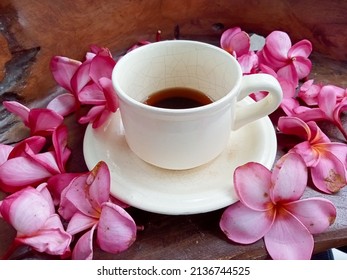 Coffee cups surrounded by Cambodian flowers