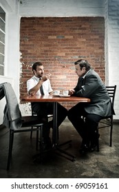 Coffee date debate between two men during their lunch break