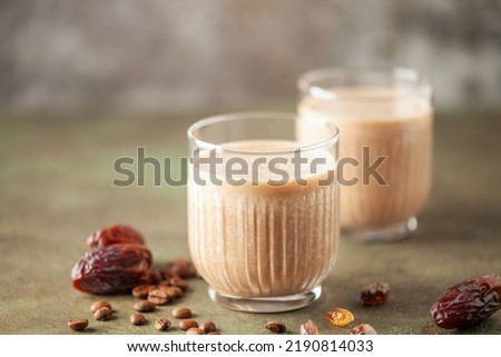 Coffee date smoothie creamy milkshake in glass. Healthy breakfast. Chunky monkey smoothie