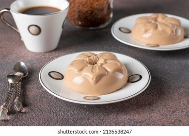 Coffee Dessert Made From Cream And Gelatin In Portion Molds On Brown Background. Dessert Blancmange