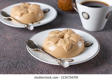 Coffee Dessert Made From Cream And Gelatin In Portion Molds On A Brown Background. Dessert Blancmange