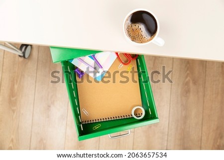 coffee and drawer open on table