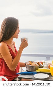 Coffee Drink Happy Asian Woman Drinking Tea Cup On Morning Breakfast Outside In Sun Enjoying Food At Hotel Restaurant Or Cruise Ship Balcony Suite.